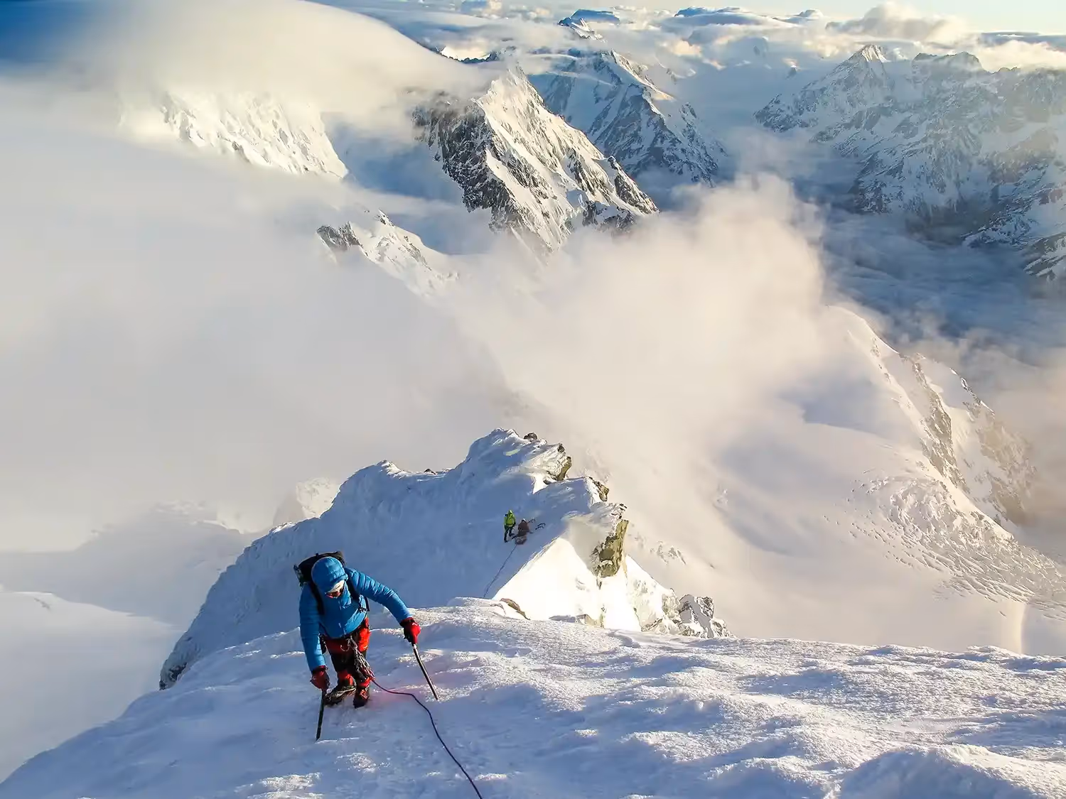 Aoraki Mount Cook guest resting before ascending steep snowy slope