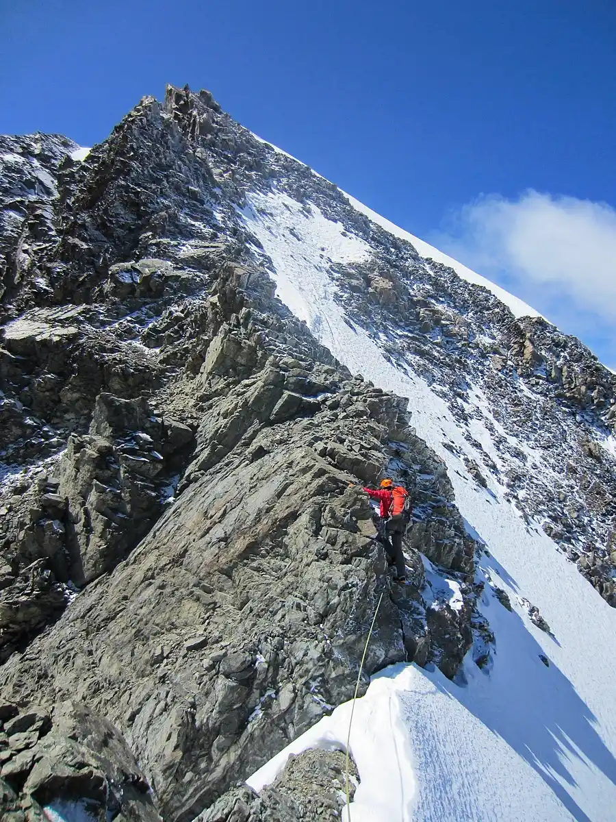 Malte Brun trip guest rock climbing near summit