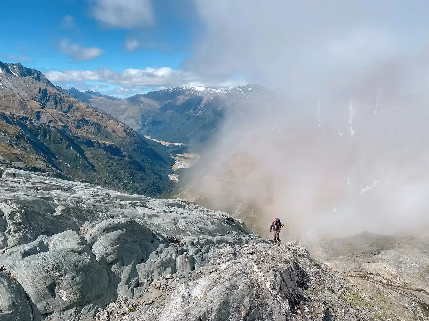 Guest climbing up rocky slope