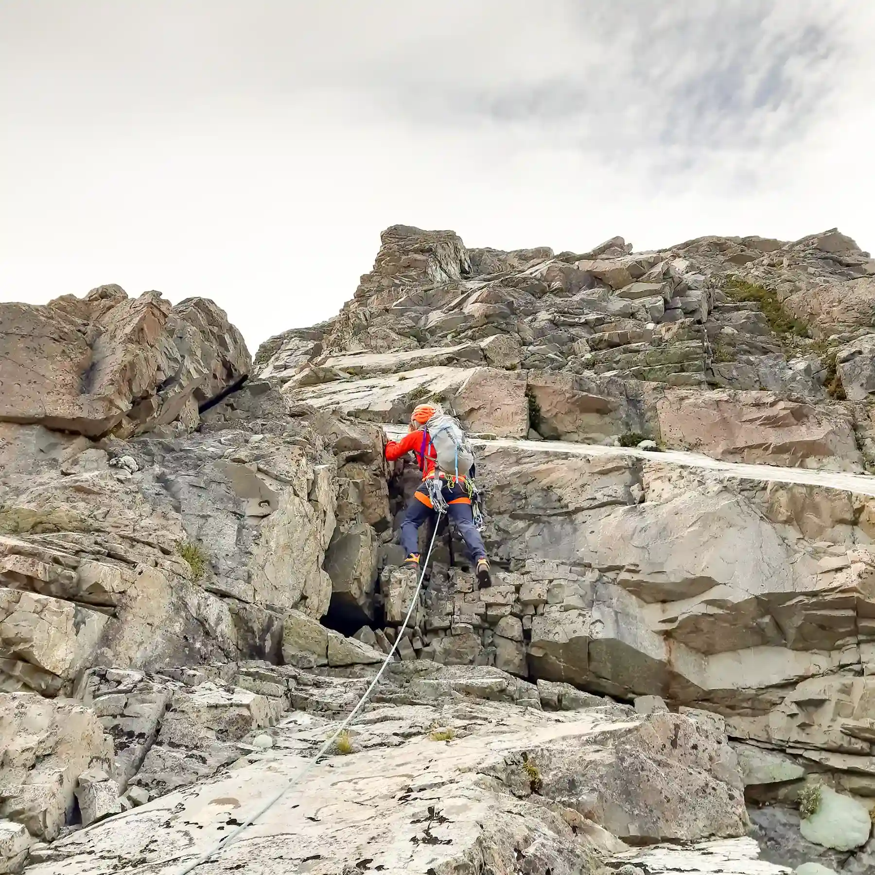 Guideless Route participant rock climbing.