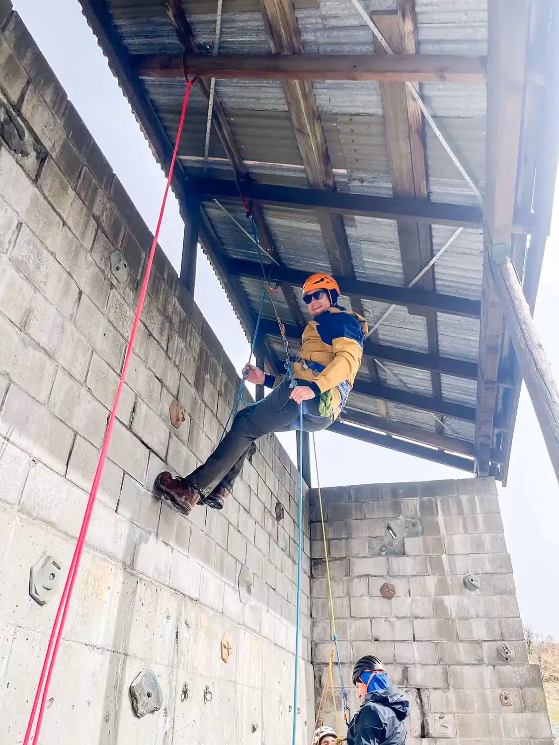 lpine Skills Course participants learning abseiling at Alpine Guides base