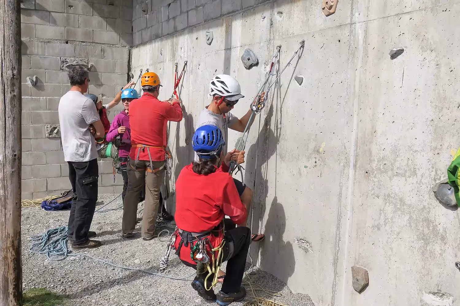 Tune up participants practice rope skill on the climbing wall