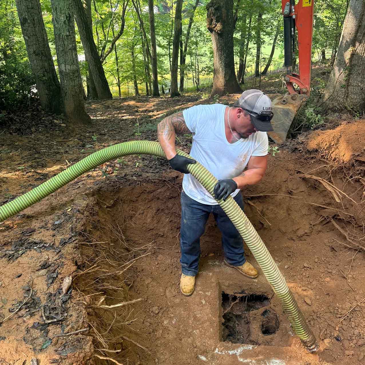Septic tank pumping in north Georgia; team pumping tank on-site for client.