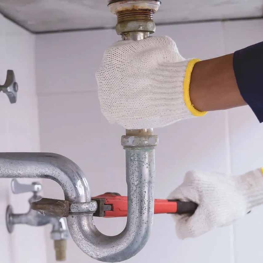 Plumbing in north Georgia; fixing pipes under kitchen sink.