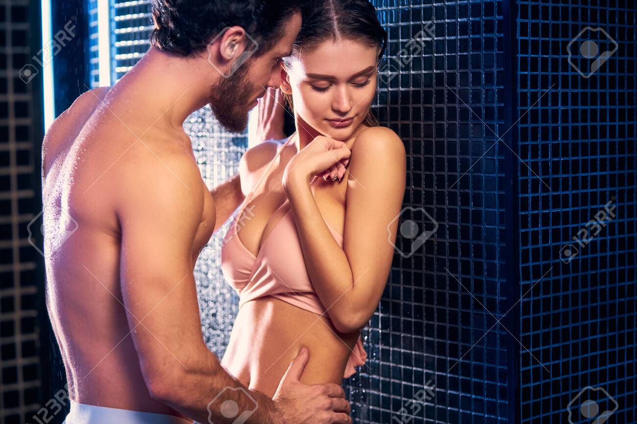 134910952-romantic-couple-fall-in-love-with-each-other-young-man-hugging-girlfriend-isolated-over-blue-shower.jpg