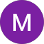 Violetti ympyrä, jossa valkoinen M-kirjain keskellä.