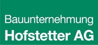 Logo der Bauunternehmung Hofstetter AG auf grünem Hintergrund.