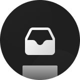 White inbox tray icon on a dark circular background.