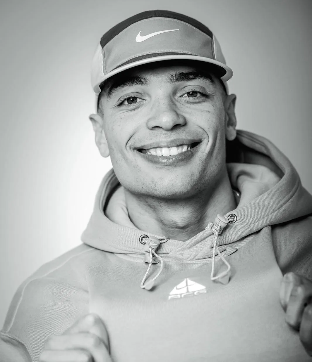 Kofi Boateng posing facing the camera in a hoodie