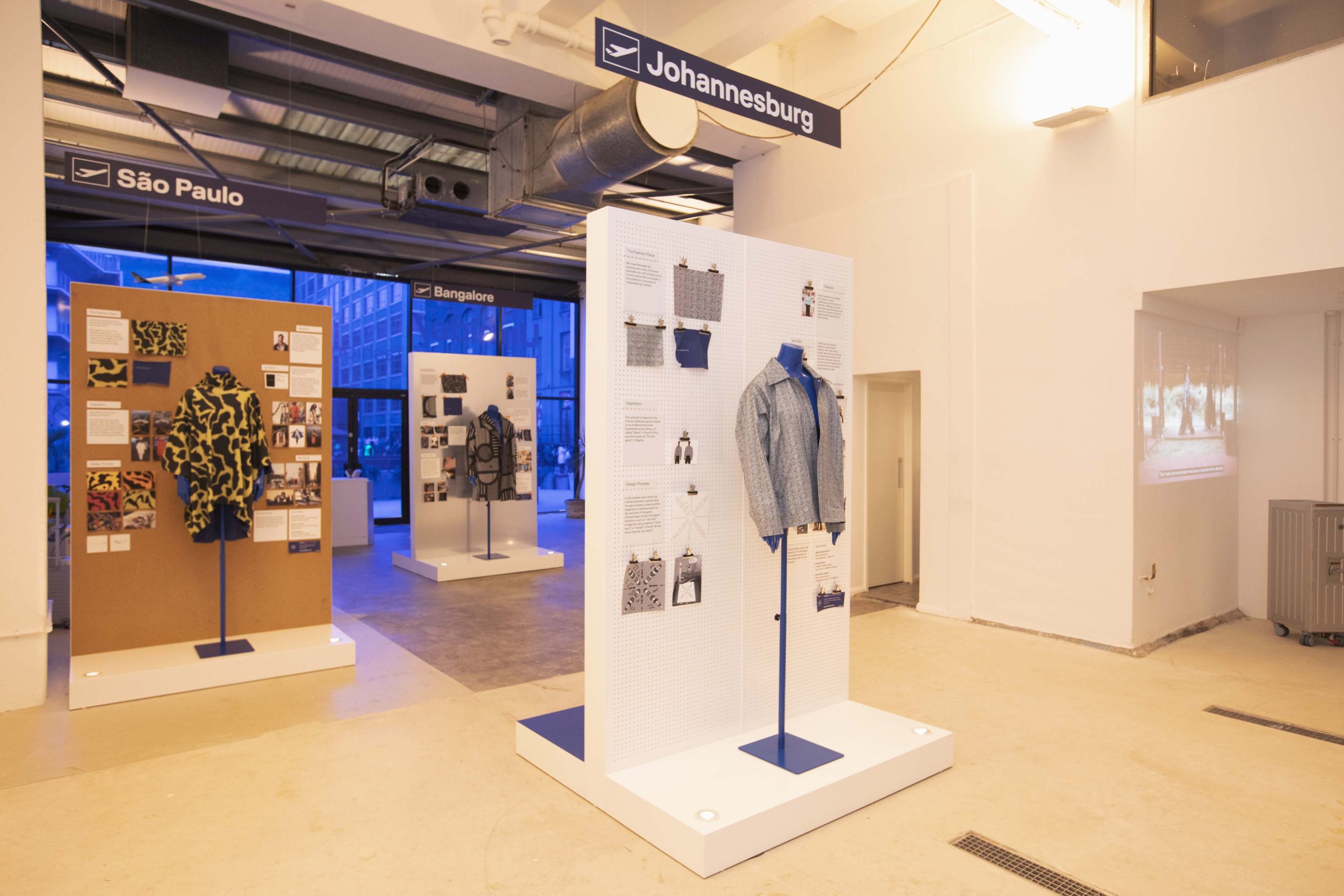 Bespoke jacket displays with design mood boards for Johannesburg, São Paulo, and Bangalore destinations at Lufthansa pop-up