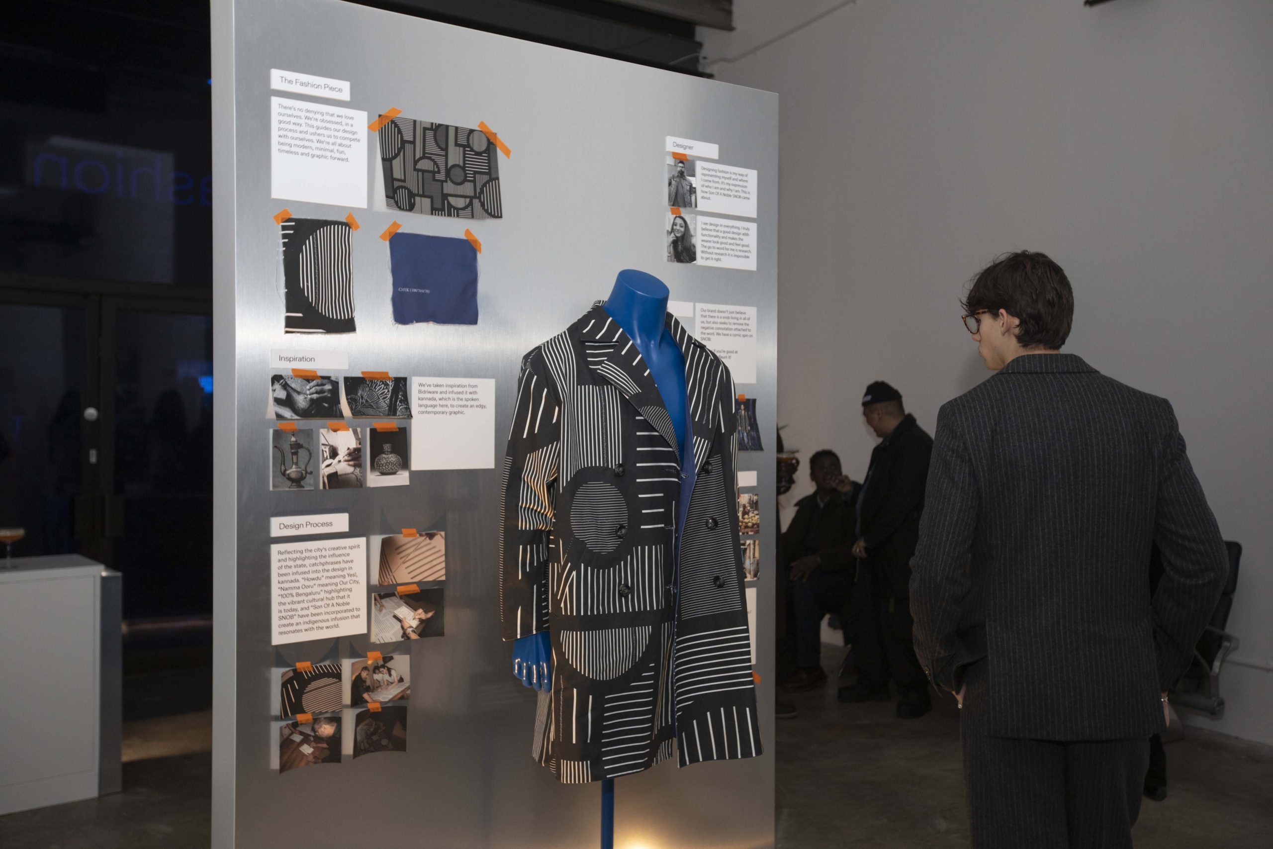 Design mood board and bespoke jacket display showing Bangalore-inspired patterns, fabric swatches, and designer process at Lufthansa pop-up