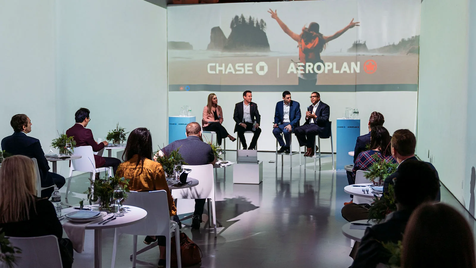 Four-person panel on stage at the Chase and Aeroplan event at LUME Studios