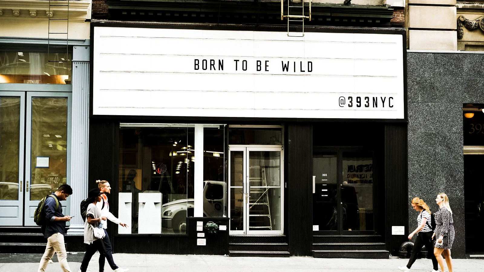 The LUME Studios marquee at 393 Broadway reading BORN TO BE WILD and @393NYC, the venue's former name