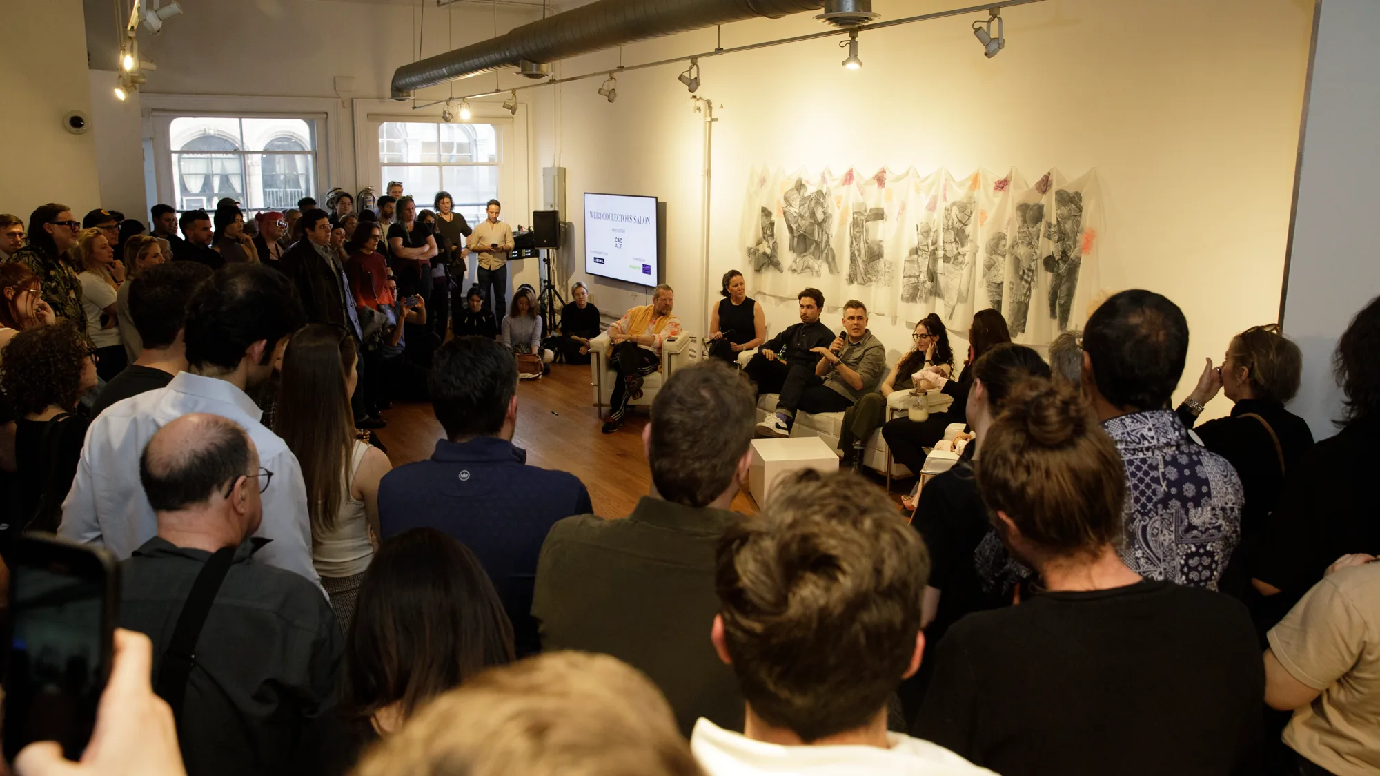 Seated audience for a presentation in Loft 5 at LUME Studios, 393 Broadway