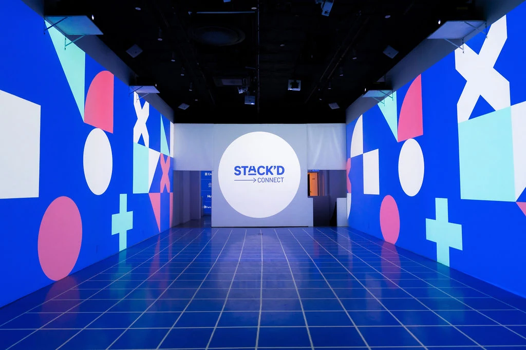 Brand activation event at LUME Studios NYC with guests and blue projection mapping immersive environment