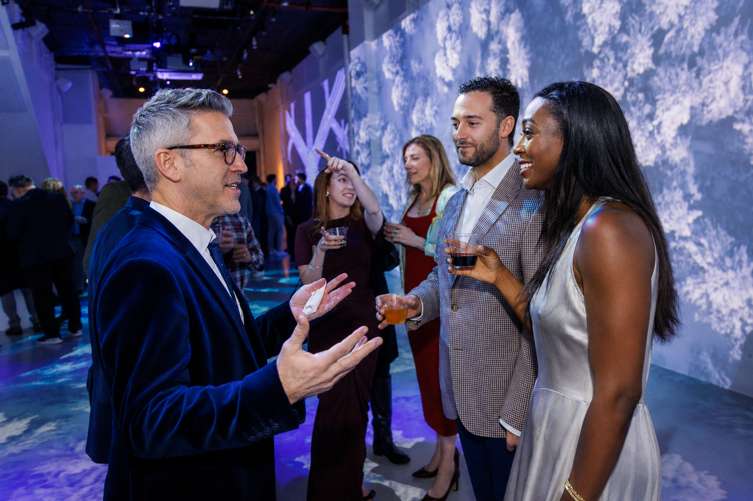 Panel discussion at LUME Studios with immersive backdrop