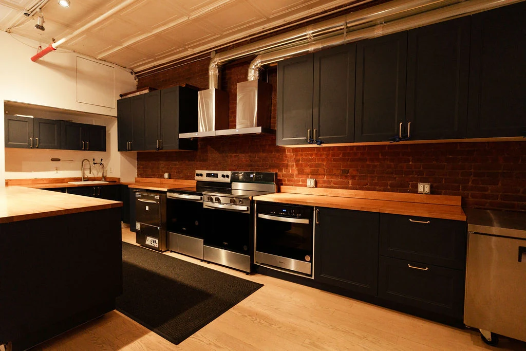 LUME Studios — Loft 4 kitchen full wide black cabinets island