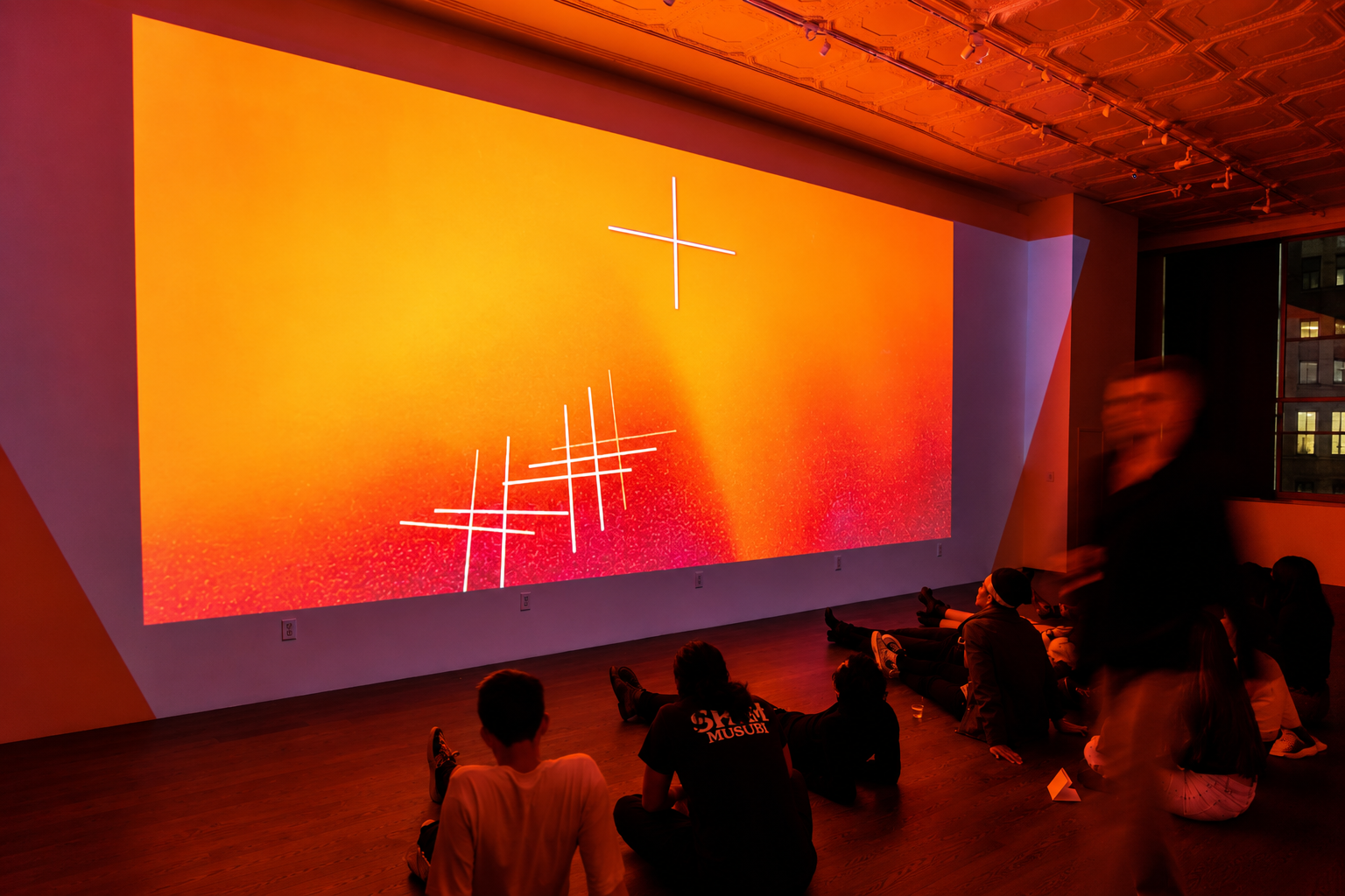Audience at a projected presentation in LOFT 2