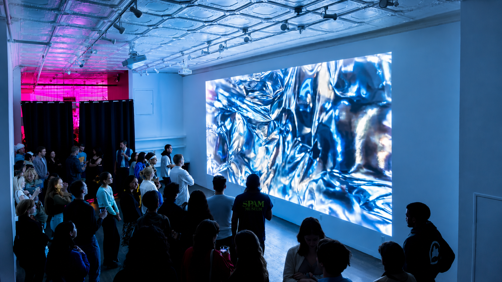 Guests watching a projection screening in LOFT 2
