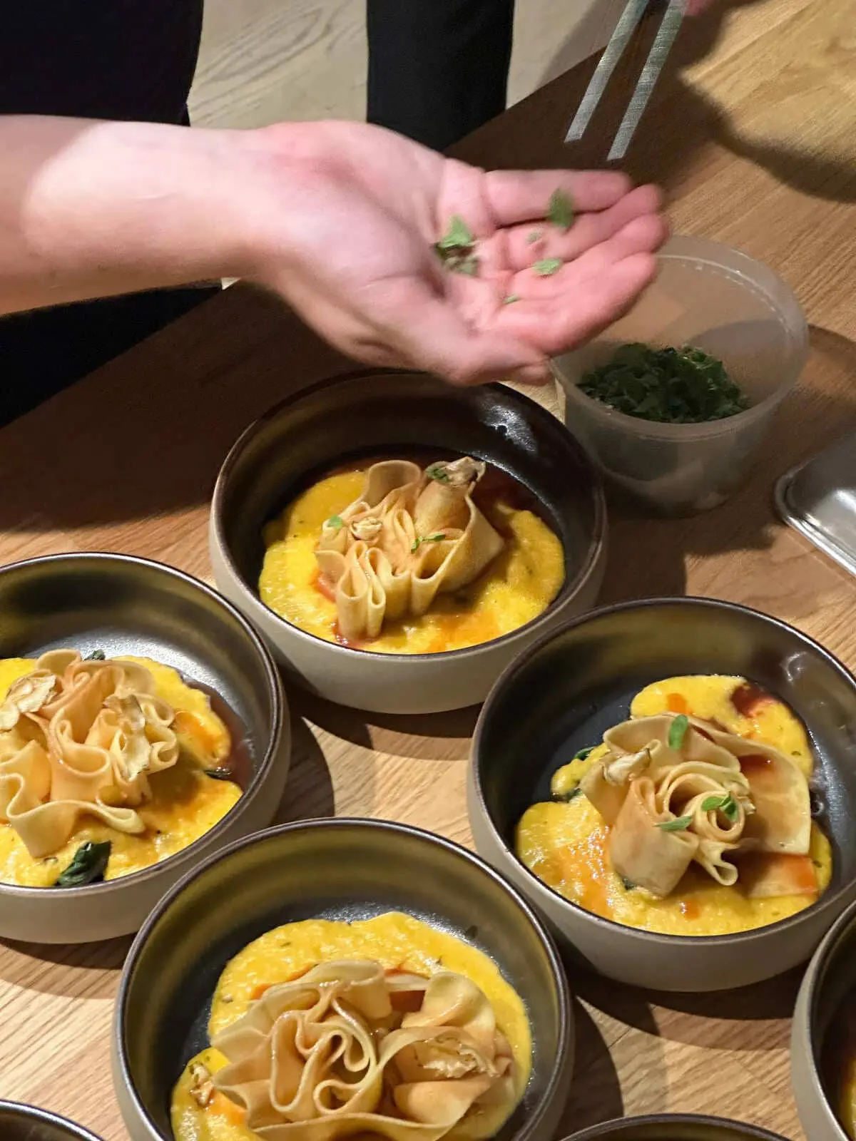 Chef plating a course at a private dinner in LOFT 4
