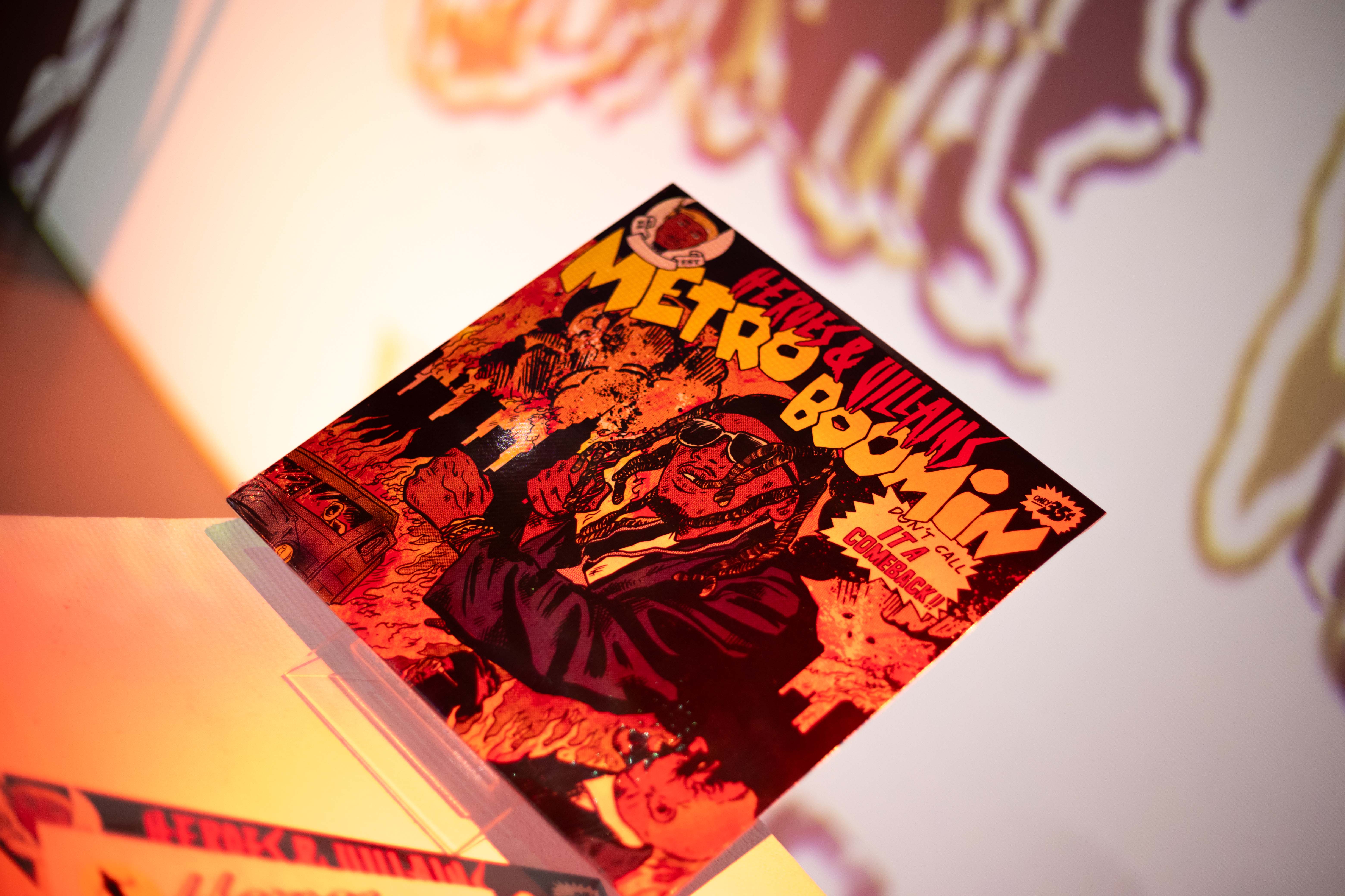 Metro Boomin Heroes and Villains comic-style album art on display at LUME Studios