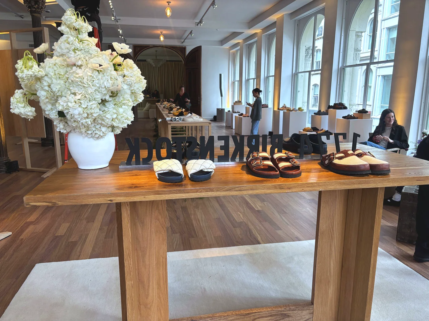 Birkenstock off-site showroom, product table florals, lighting and projection by LUME Studios
