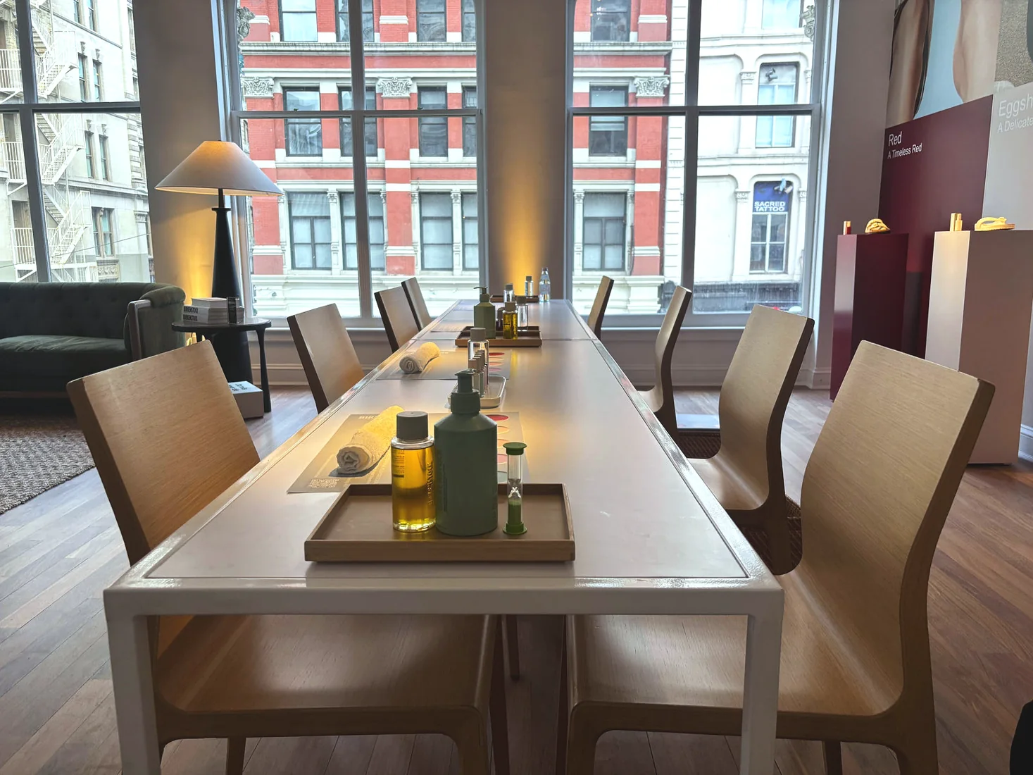 Birkenstock off-site showroom, dining by windows, lighting and projection by LUME Studios