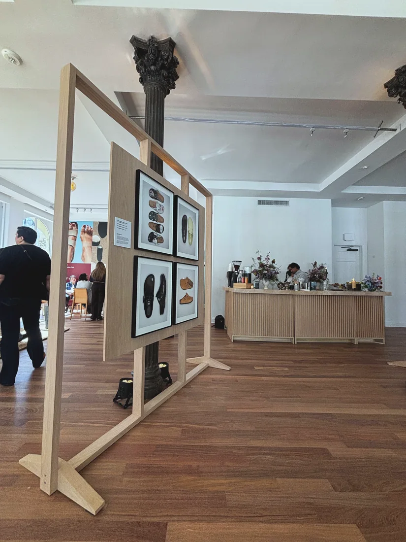 Birkenstock off-site showroom, framed product artwork panel in the lit room
