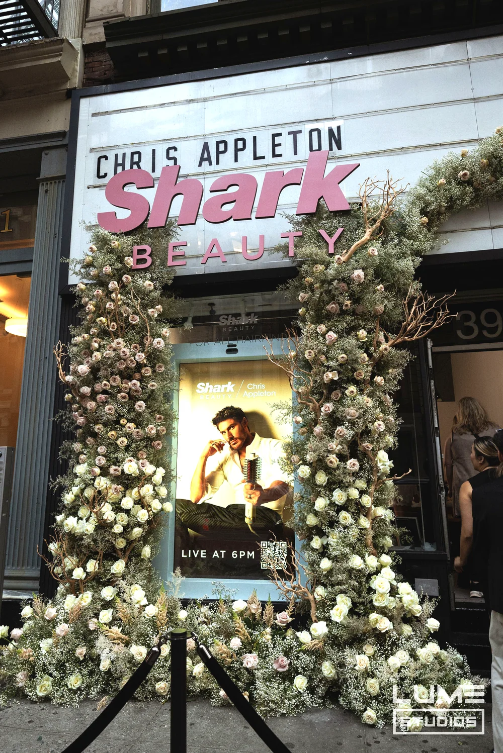 Shark Beauty x Chris Appleton at LUME Studios, floral arch poster