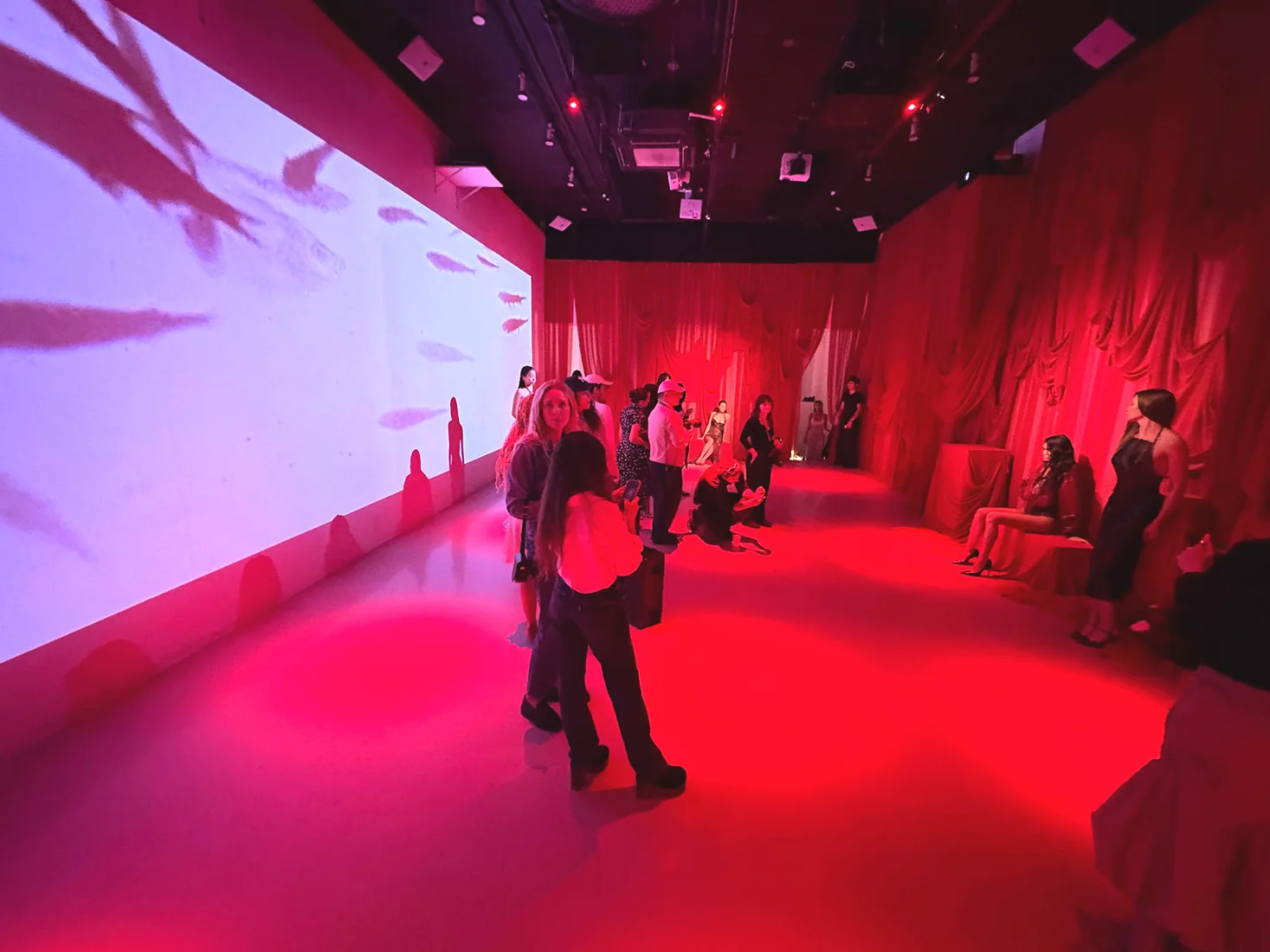 HILA SS27 presentation at LUME Studios, violet wall guests