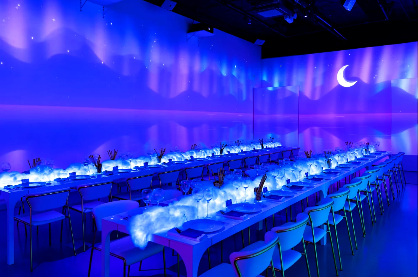 Roku executive dinner at LUME Studios, tables under a starry projected sky