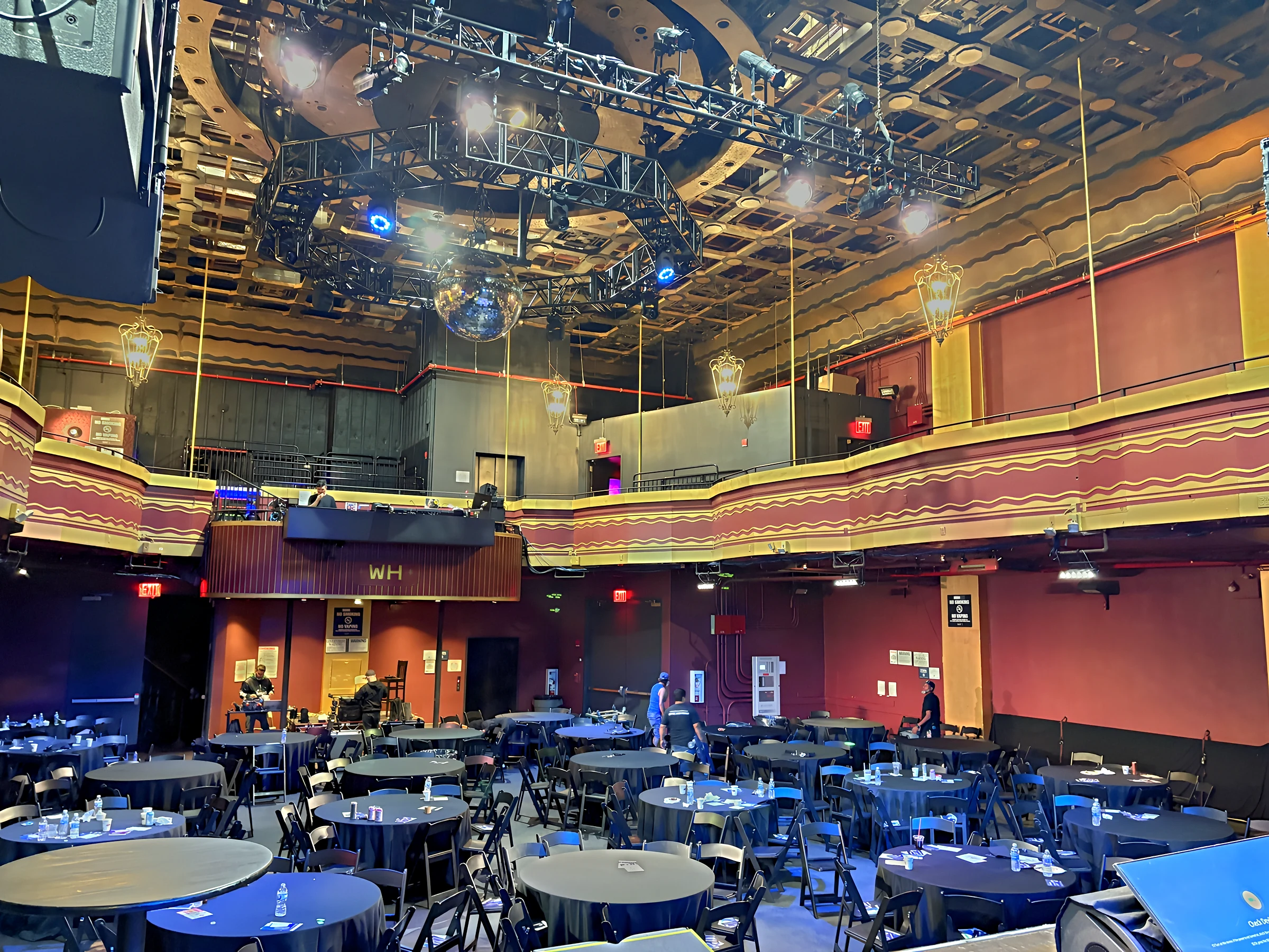 Webster Hall ballroom set with round tables, line arrays, and stage lighting before doors at the Q4 Summit.