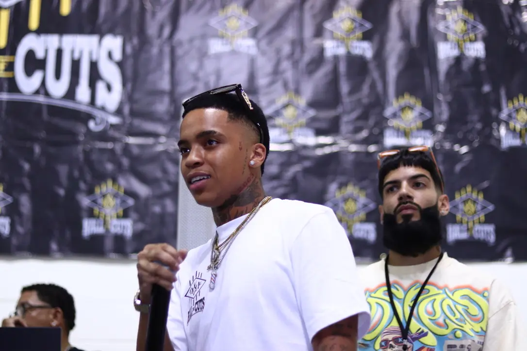 TK Blendz, founder and owner of the Hall of Cuts Akron Barber Tradeshow, pictured at a live barber and beauty industry event