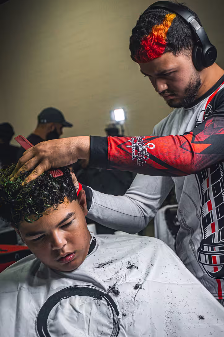 Why come to the HOC Tradeshow-- Live barber battle in progress at the Hall of Cuts Barber and Beauty Expo in Akron, Ohio, showing real-time competition and industry skill on display