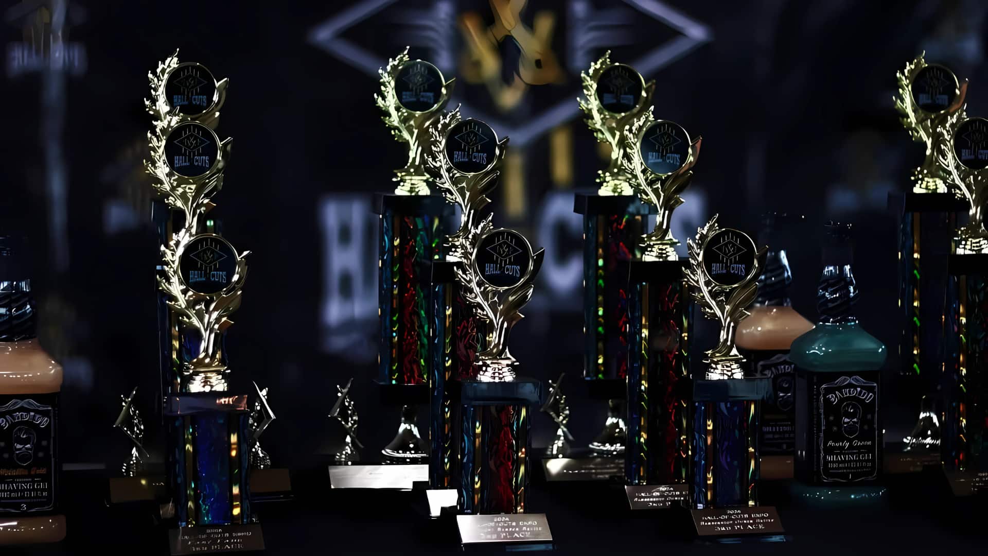 Hall of Cuts trophies displayed for live competition winners at the Hall of Cuts Akron Barber Tradeshow, representing cash prizes, vacation packages, and industry recognition