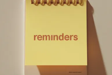 Yellow spiral notepad with the word 'reminders' printed in bold brown text.