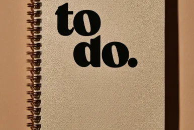 Beige spiral notebook with the words 'to do.' printed in large black letters on the cover.