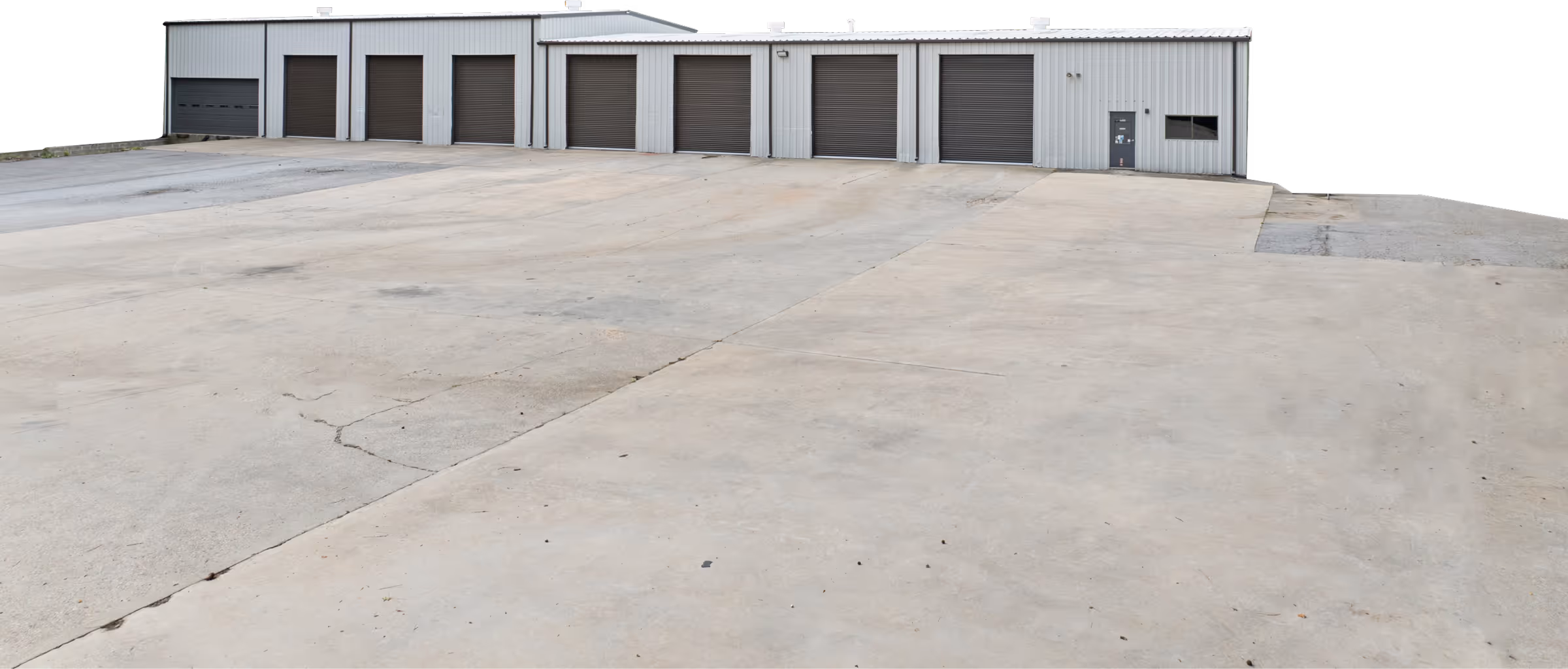Image of a warehouse with several garage doors