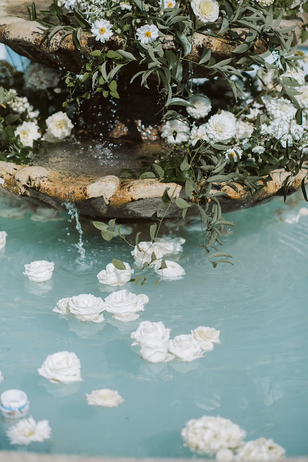 Garden water feature with floating white florals at Belvedere Estate, Saugatuck Michigan
