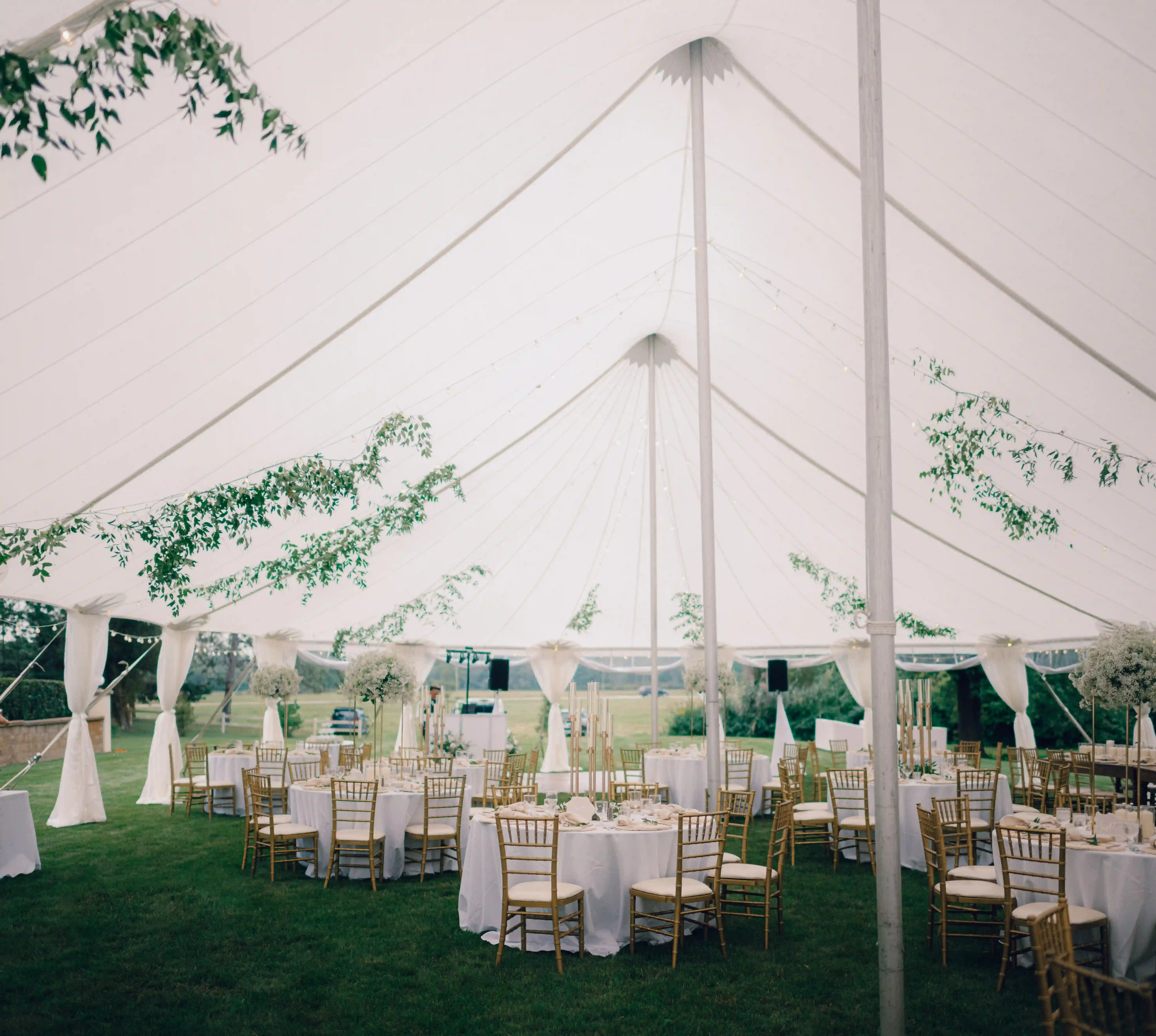 Elegant tented outdoor wedding reception setup at Belvedere Estate in Saugatuck, Michigan