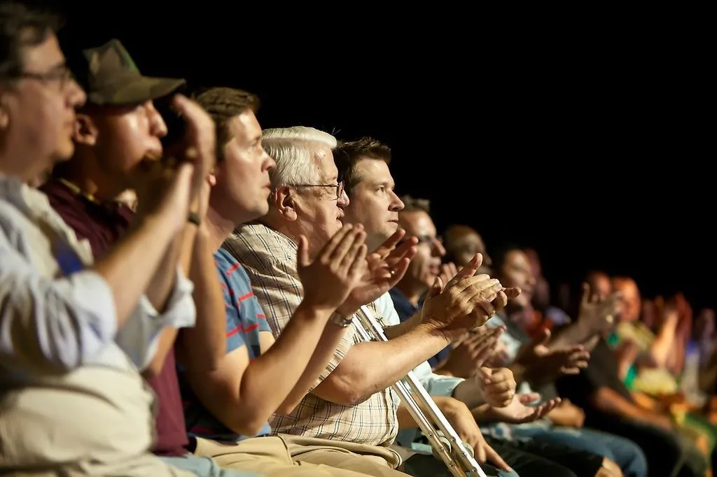 Audience applauding during a high energy Nazareth standup performance