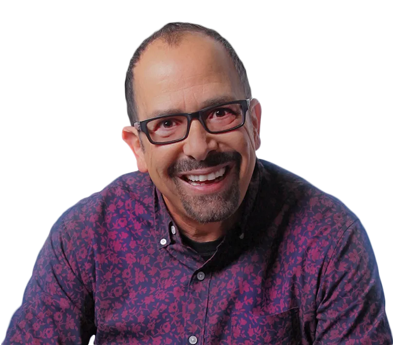 Close up portrait of Nazareth smiling warmly in studio lighting