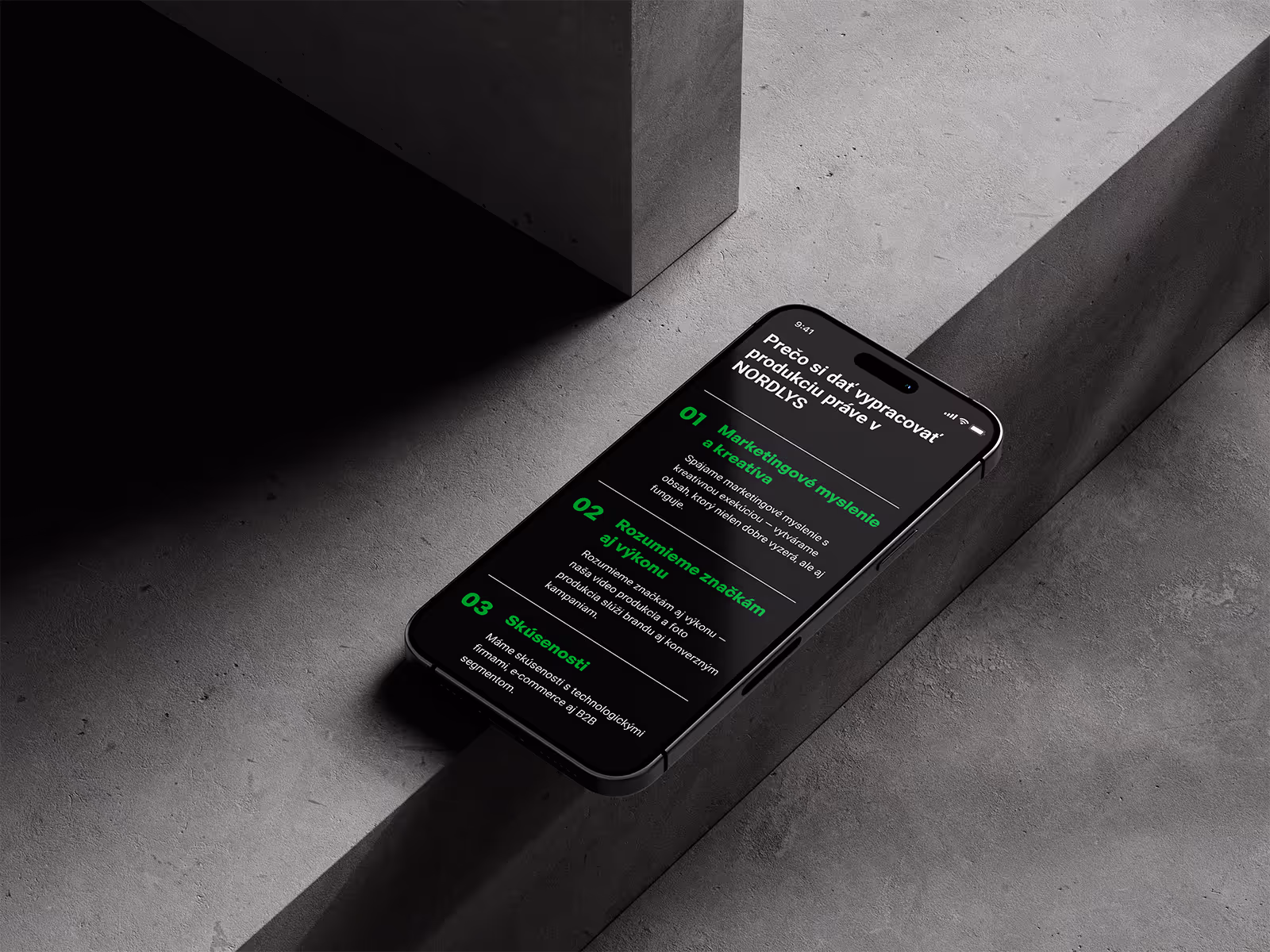 Smartphone displaying a list of three reasons why to produce with NORDLYS, written in Slovak on a dark background with green and white text.