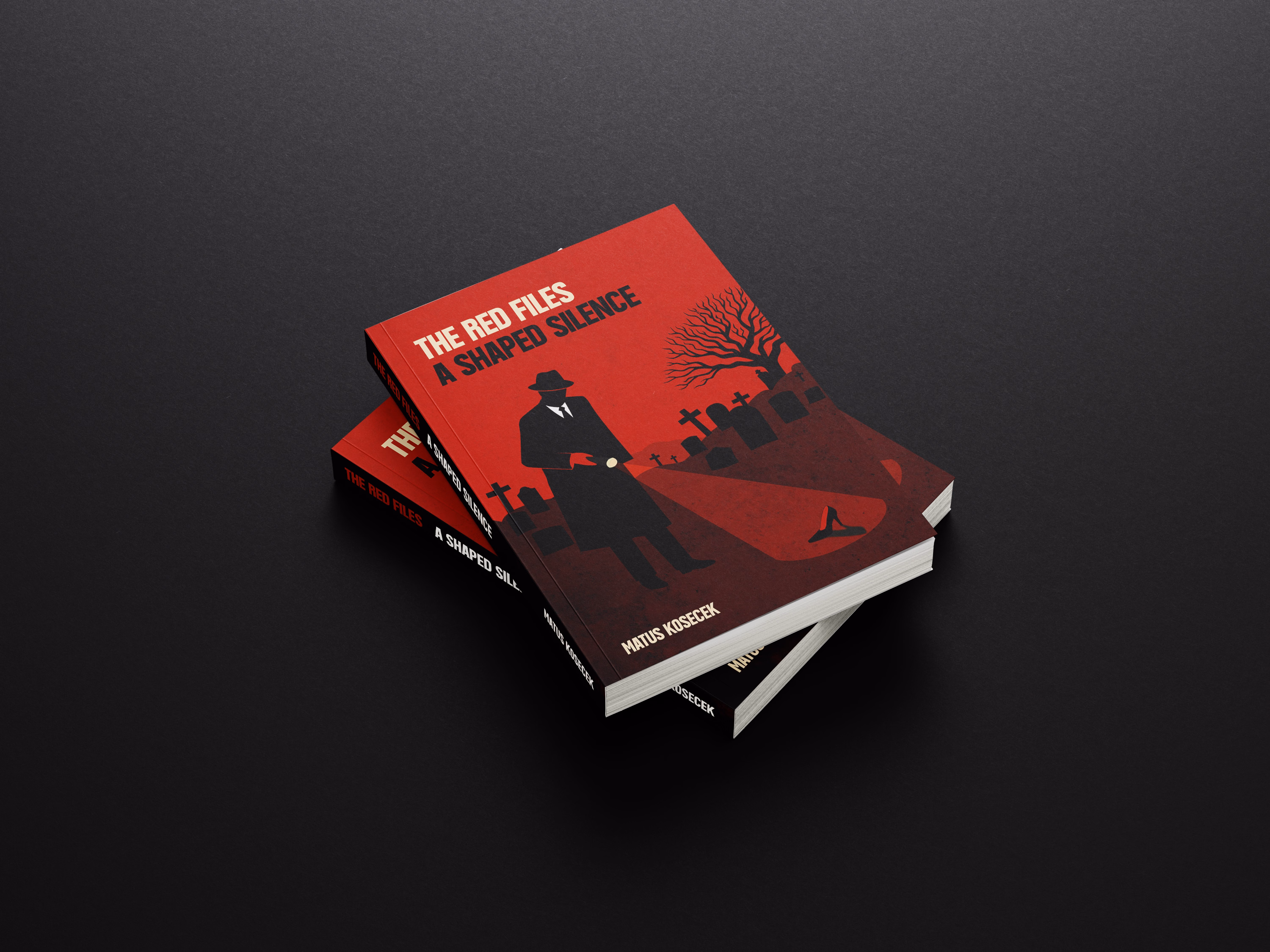 Two stacked copies of a book titled 'The Red Files A Shaped Silence' by Matus Kosecek, featuring a red and black cover design with a silhouetted figure holding a flashlight in a graveyard setting.