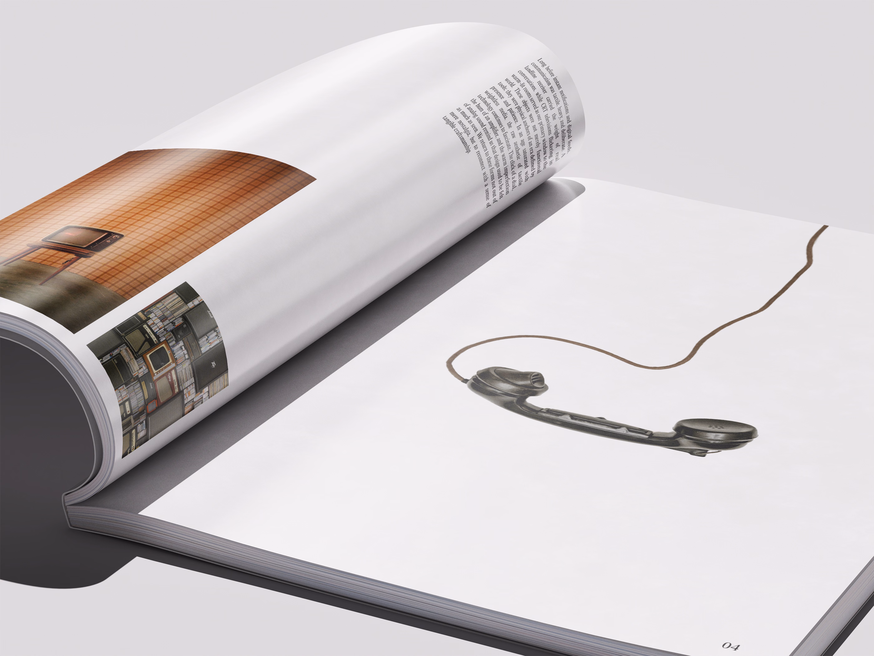 Open magazine showing a page with an illustration of a black telephone handset connected by a cord on a white background.