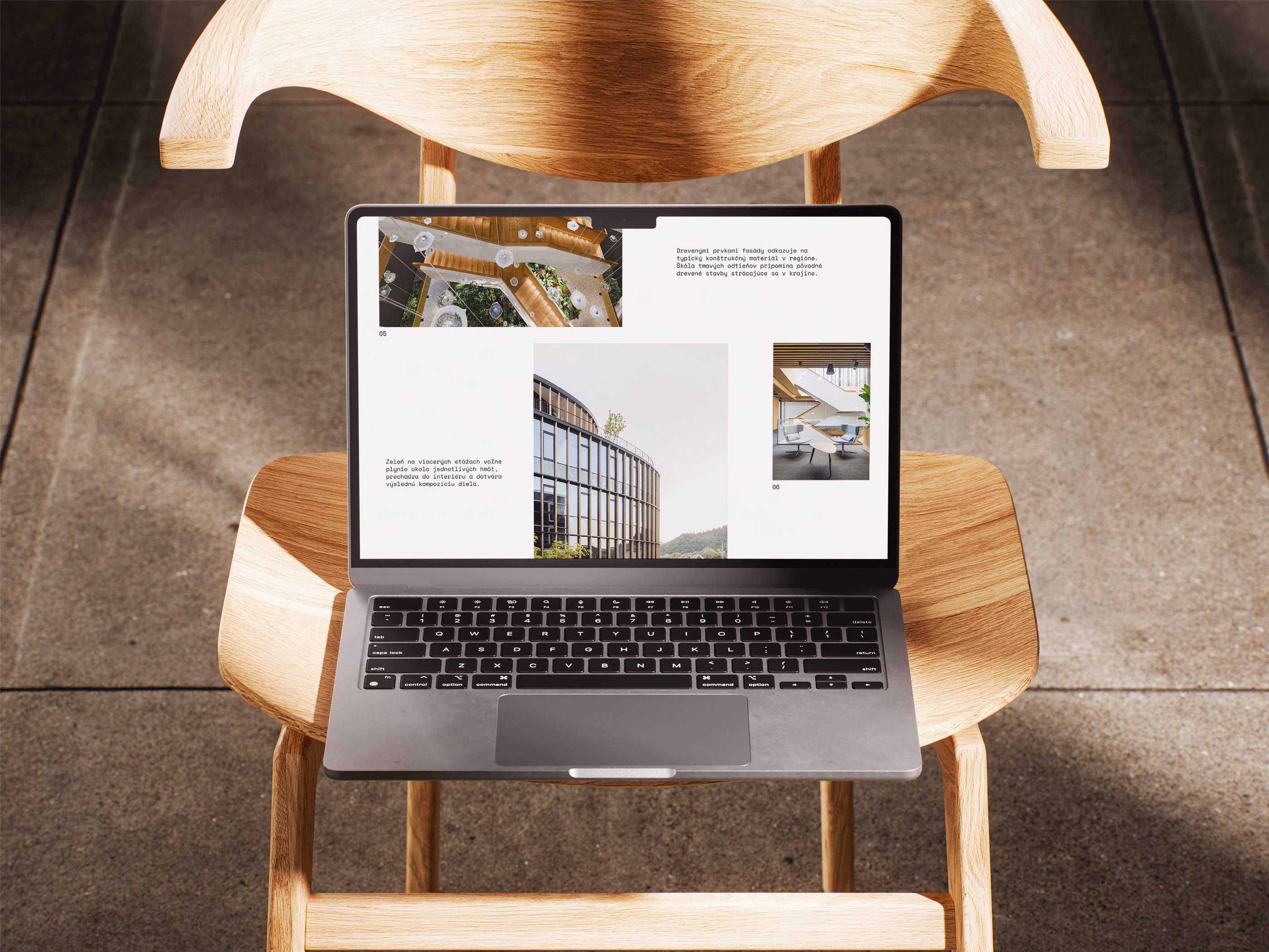 Open laptop displaying architectural presentation with images of buildings and text, placed on a wooden chair on a tiled floor.