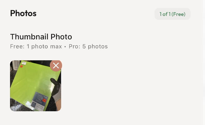 App interface showing one free thumbnail photo uploaded, depicting a hand holding a bright green flat item.