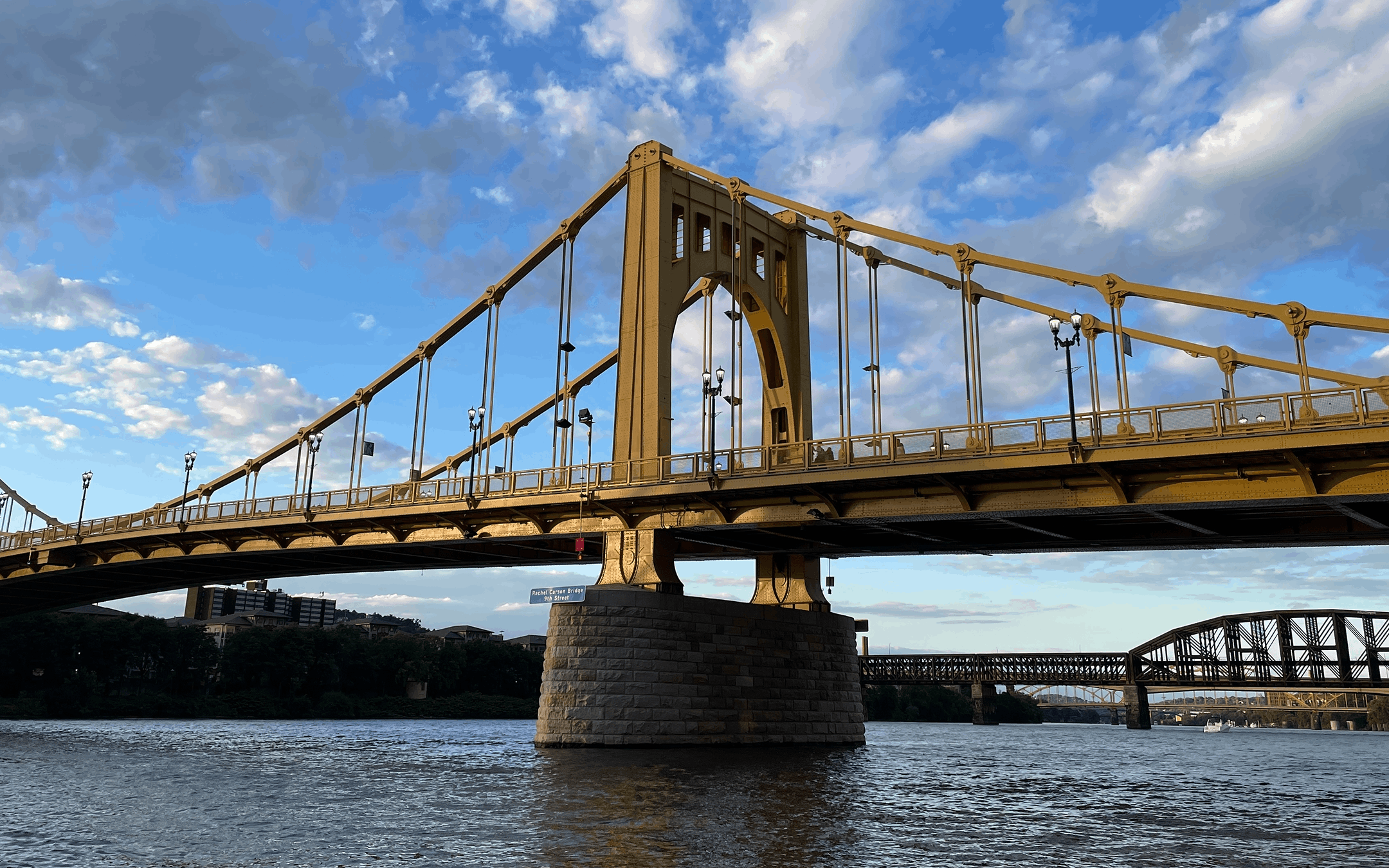 Iconic bridge spanning a river, symbolizing stability and connection in private wealth management.