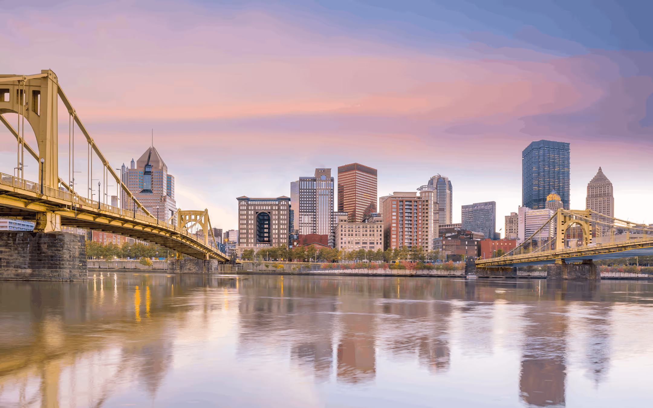 City skyline with river and bridges, reflecting a trusted financial advisory firm with regional roots.