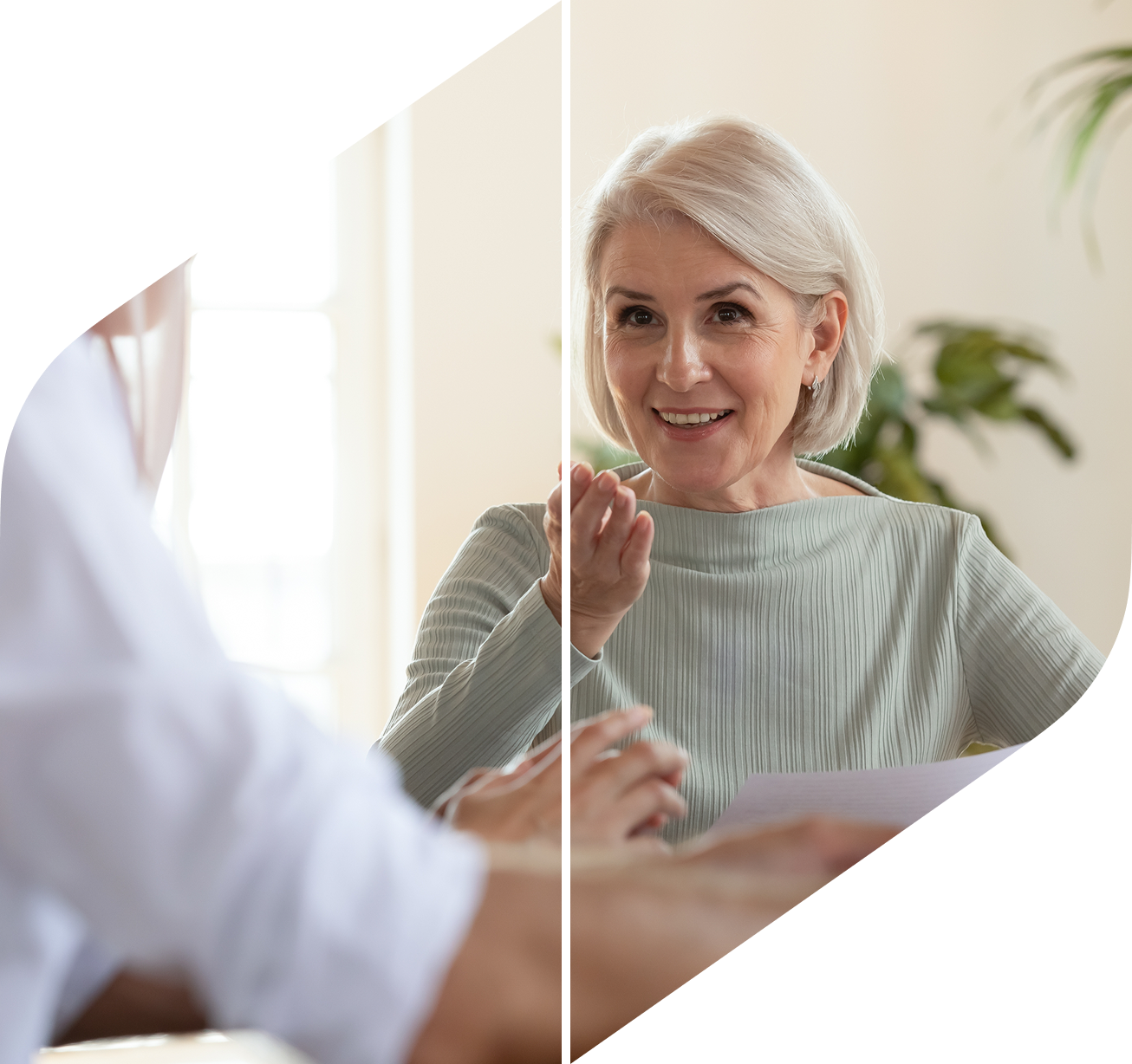 Woman discussing documents with an advisor during a personalized financial advisory meeting.